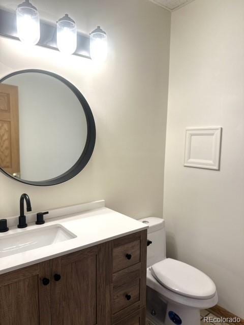 bathroom with vanity and toilet