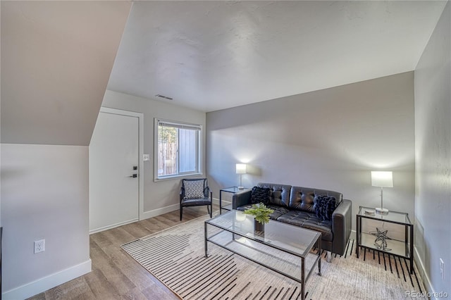 living room with light hardwood / wood-style flooring