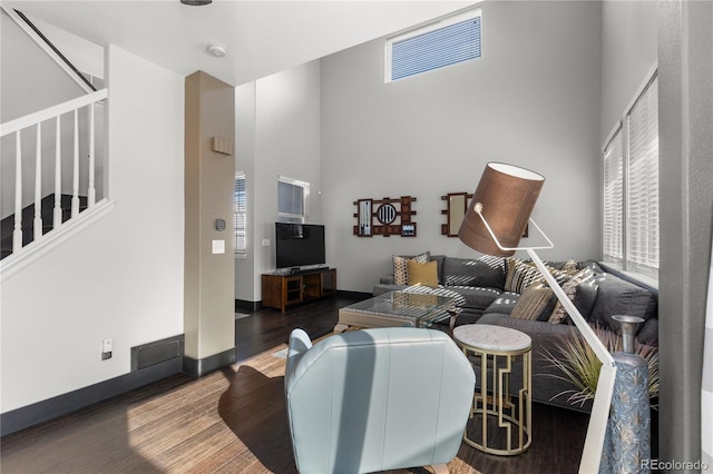 living room featuring dark wood-type flooring