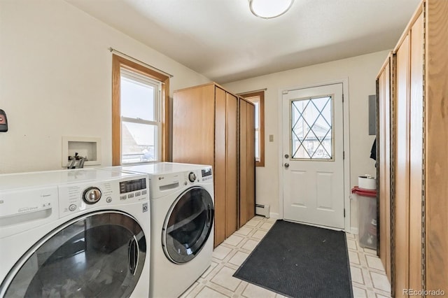 washroom featuring a wealth of natural light, baseboard heating, independent washer and dryer, and light floors