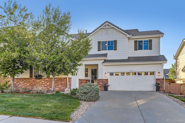 craftsman house with brick siding, driveway, an attached garage, and board and batten siding