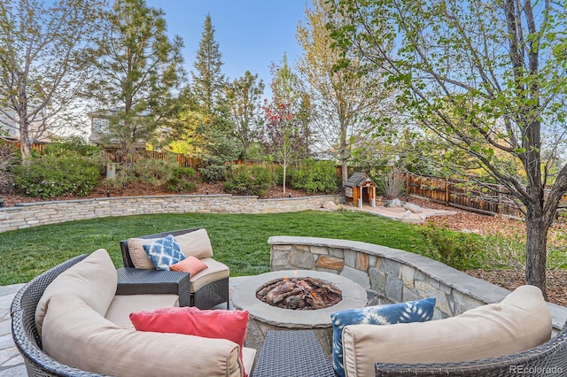 view of patio featuring an outdoor living space with a fire pit