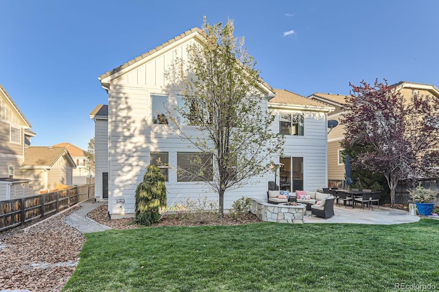 back of property featuring a patio, board and batten siding, and an outdoor hangout area