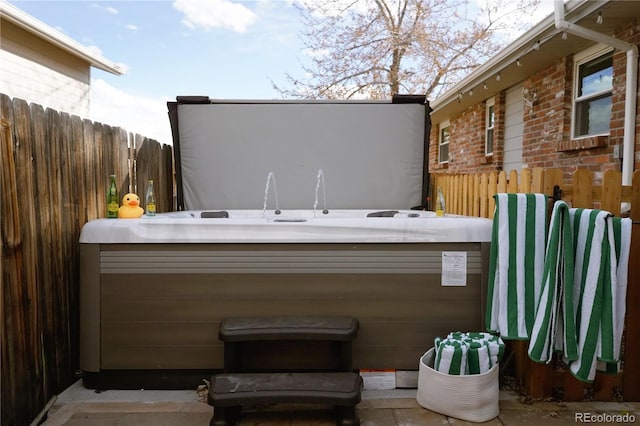 view of patio / terrace featuring a hot tub