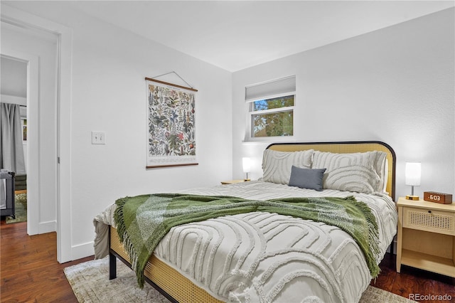 bedroom featuring dark hardwood / wood-style flooring