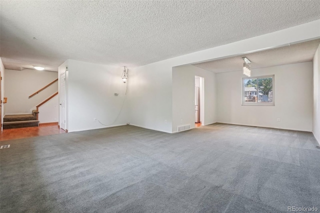 6121 W 108th Ave, Westminster, CO 80020 - carpeted empty room with stairs and a textured ceiling