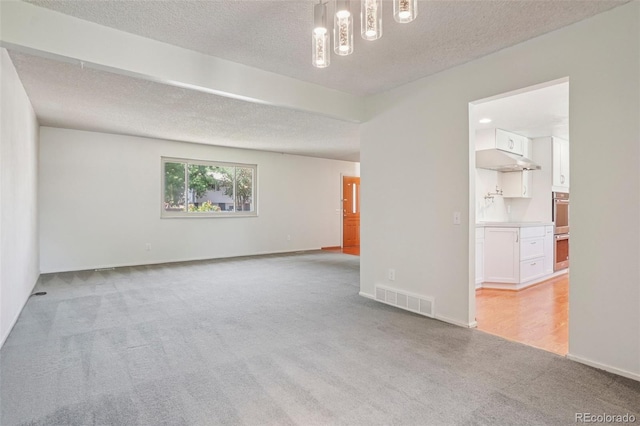 6121 W 108th Ave, Westminster, CO 80020 - empty room with light colored carpet and a textured ceiling