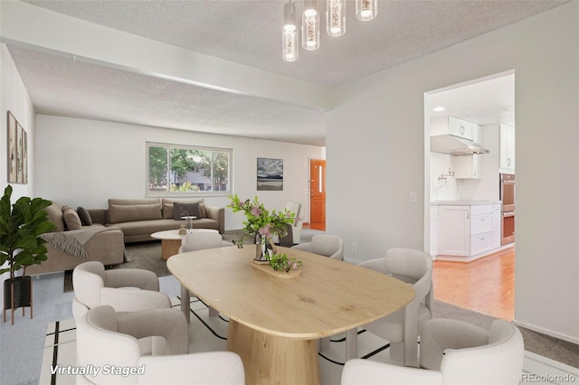 6121 W 108th Ave, Westminster, CO 80020 - dining space featuring a textured ceiling and light carpet