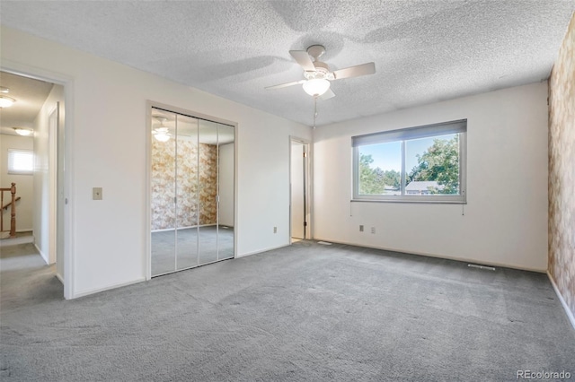 6121 W 108th Ave, Westminster, CO 80020 - unfurnished bedroom featuring carpet, a textured ceiling, a ceiling fan, and a closet