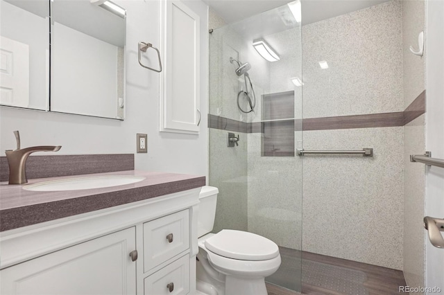 6121 W 108th Ave, Westminster, CO 80020 - full bath featuring vanity, walk in shower, and wood finished floors