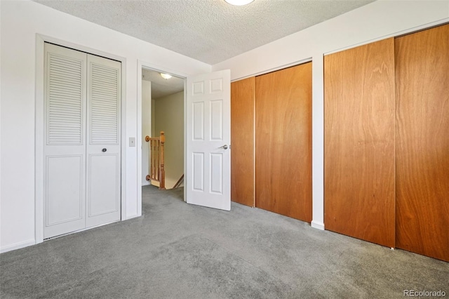 6121 W 108th Ave, Westminster, CO 80020 - unfurnished bedroom with two closets, carpet floors, and a textured ceiling