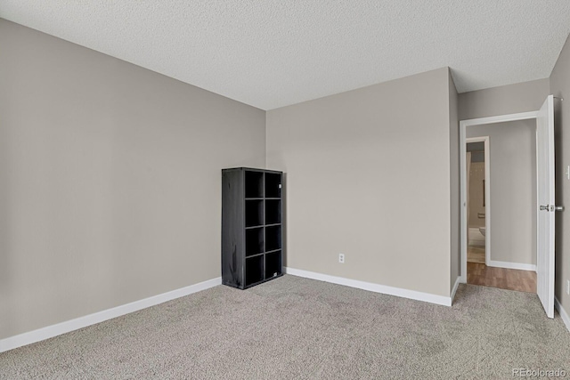 14001 E Marina Dr Unit 603, Aurora, CO 80014 - unfurnished room with baseboards, a textured ceiling, and carpet