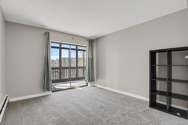 14001 E Marina Dr Unit 603, Aurora, CO 80014 - empty room featuring carpet, a textured ceiling, and baseboard heating