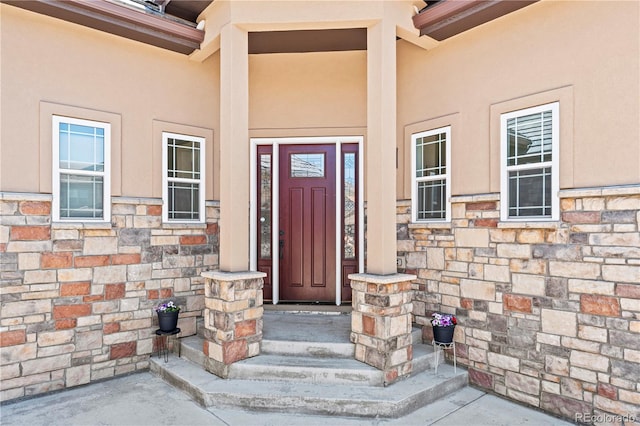 6532 S Tempe St, Aurora, CO 80016 - view of exterior entry with stone siding and stucco siding