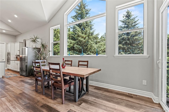 6532 S Tempe St, Aurora, CO 80016 - dining room featuring vaulted ceiling, wood finished floors, and recessed lighting