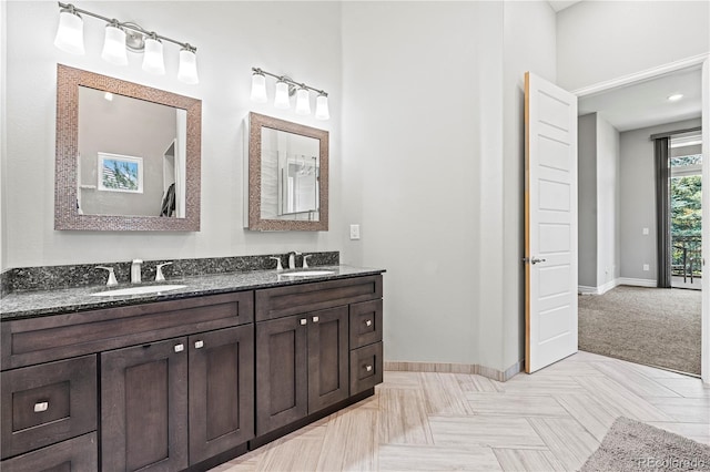 6532 S Tempe St, Aurora, CO 80016 - full bathroom with baseboards and double vanity