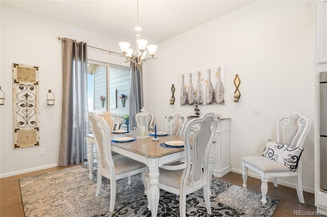 25049 E Alder Dr, Aurora, CO 80016 - dining area with a chandelier, wood finished floors, and baseboards