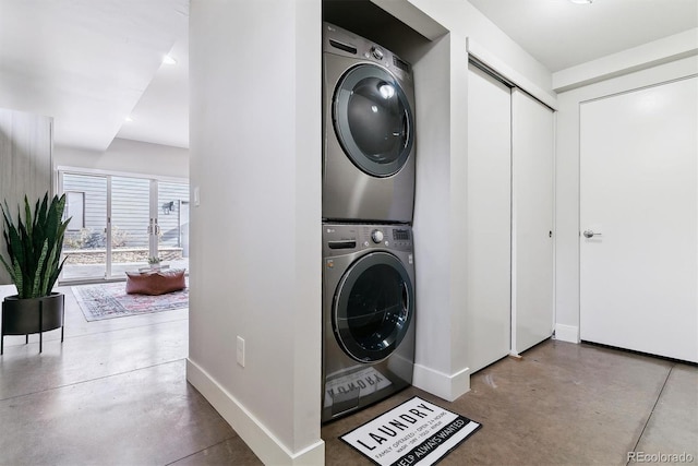 laundry room with stacked washer and clothes dryer