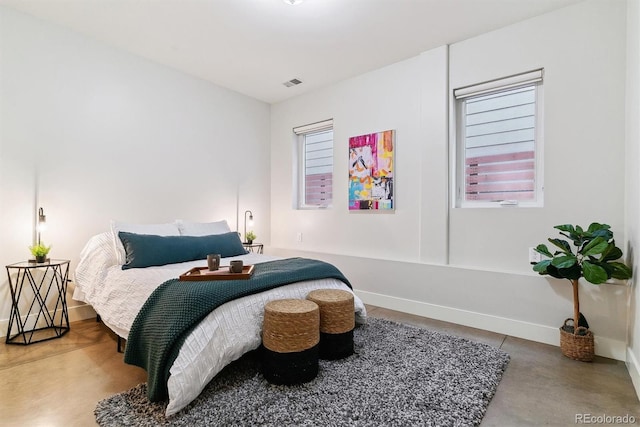 bedroom with concrete floors