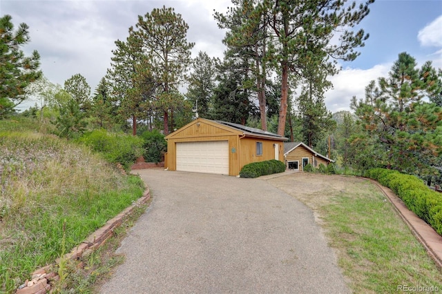 exterior space featuring an outdoor structure and a garage