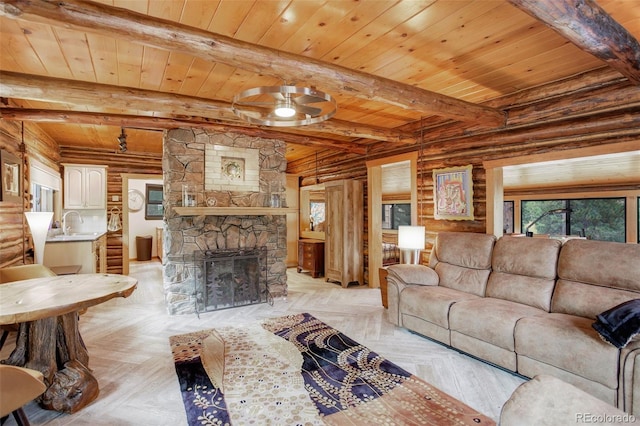 living room featuring log walls, beam ceiling, light parquet flooring, and a stone fireplace