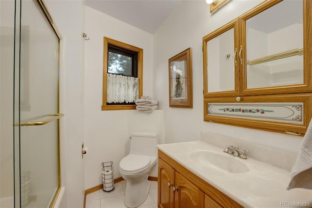 bathroom featuring tile patterned floors, vanity, a shower with shower door, and toilet