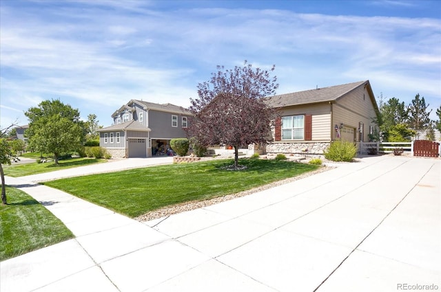 3419 Traver Dr, Broomfield, CO 80023 - view of front of property with stone siding, an attached garage, a front lawn, and concrete driveway