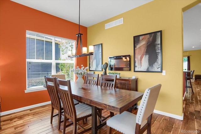 3419 Traver Dr, Broomfield, CO 80023 - dining room with wood finished floors, baseboards, and visible vents