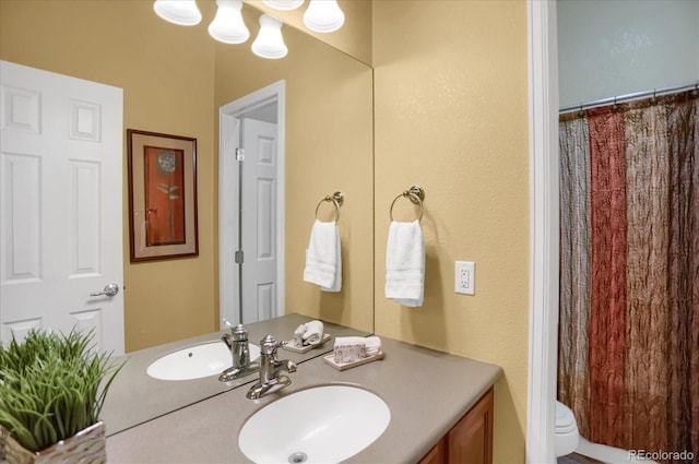 3419 Traver Dr, Broomfield, CO 80023 - bathroom featuring a shower with shower curtain, toilet, and vanity