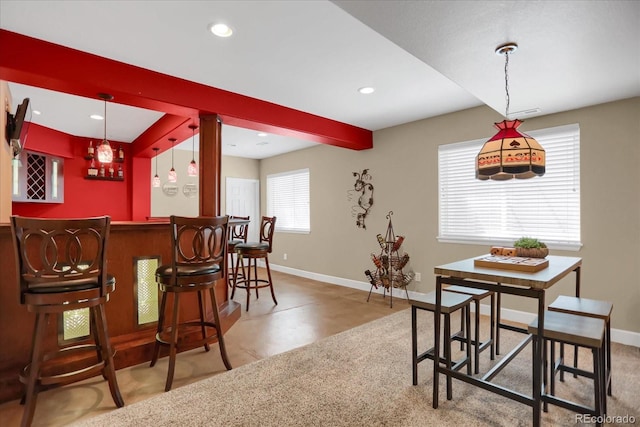3419 Traver Dr, Broomfield, CO 80023 - dining space featuring a bar, baseboards, beam ceiling, and recessed lighting