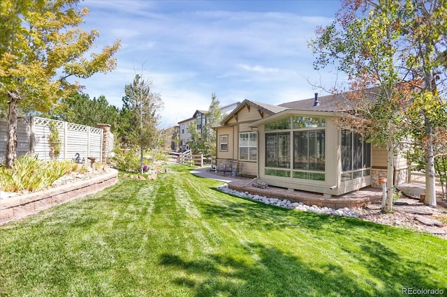 3419 Traver Dr, Broomfield, CO 80023 - view of yard with a sunroom and fence