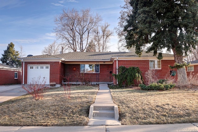 ranch-style house featuring an attached garage, concrete driveway, and brick siding