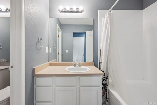 5229 Nighthawk Pkwy, Brighton, CO 80601 - bathroom with a textured wall, vanity, and shower / bath combo