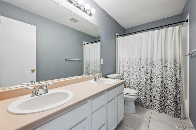 5229 Nighthawk Pkwy, Brighton, CO 80601 - bathroom featuring double vanity and tile patterned flooring