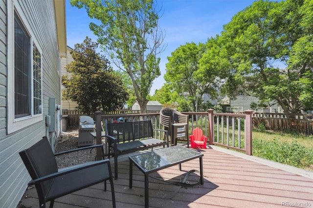 5229 Nighthawk Pkwy, Brighton, CO 80601 - wooden terrace with a fenced backyard, an outdoor living space, and a grill