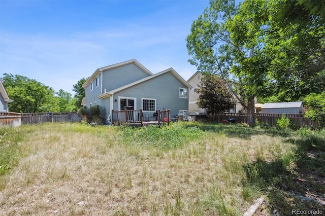 5229 Nighthawk Pkwy, Brighton, CO 80601 - back of house featuring a wooden deck