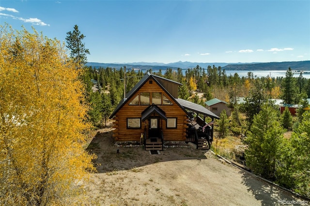 view of front of home with a water and mountain view