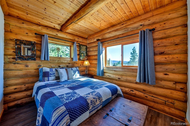 bedroom featuring beam ceiling, multiple windows, and dark hardwood / wood-style floors