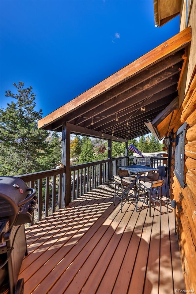 wooden terrace with area for grilling