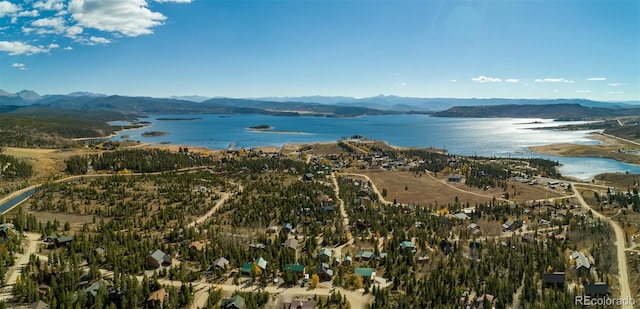 birds eye view of property featuring a water and mountain view