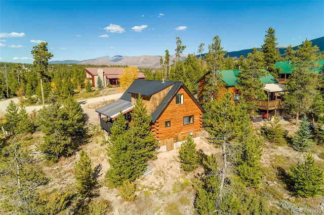 birds eye view of property featuring a mountain view