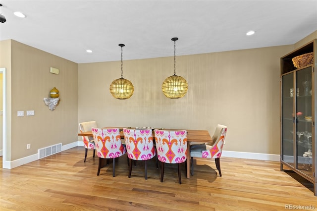 1479 S Clarkson St, Denver, CO 80210 - dining area with wood finished floors and recessed lighting