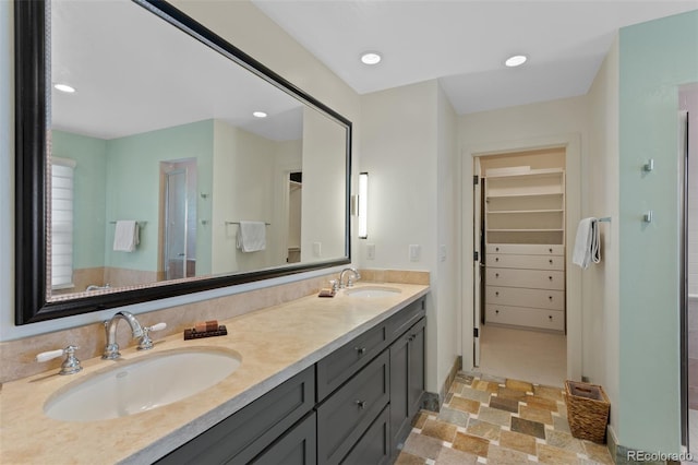 1479 S Clarkson St, Denver, CO 80210 - full bath featuring double vanity, a walk in closet, a stall shower, and recessed lighting