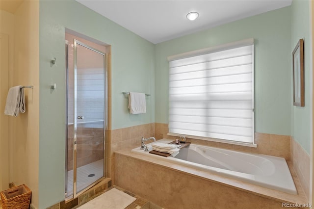 1479 S Clarkson St, Denver, CO 80210 - full bath with healthy amount of natural light, a shower stall, and a garden tub