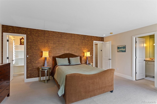 1479 S Clarkson St, Denver, CO 80210 - bedroom with light colored carpet and connected bathroom