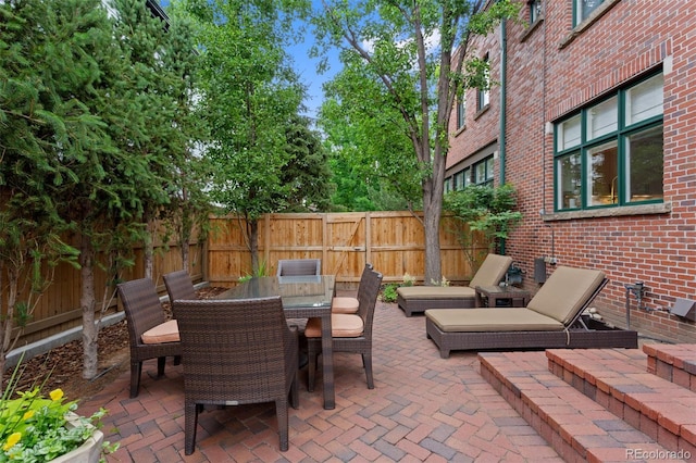 1479 S Clarkson St, Denver, CO 80210 - fenced backyard featuring a patio area and outdoor dining area