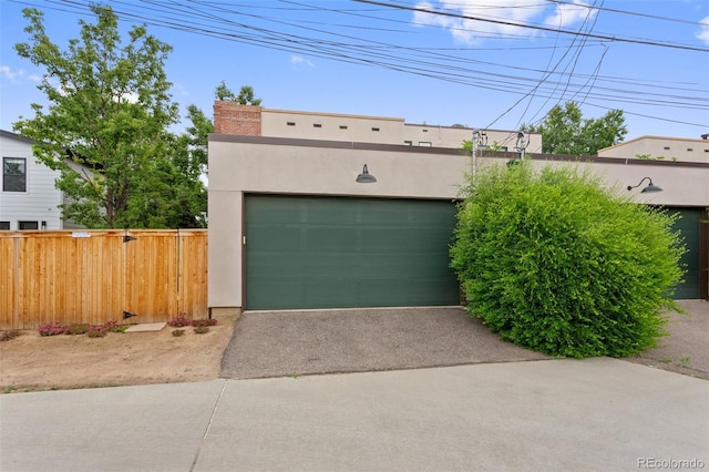 1479 S Clarkson St, Denver, CO 80210 - garage featuring asphalt driveway