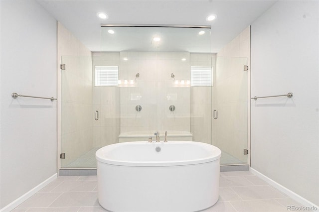 5621 Loma Vista Dr, Parker, CO 80134 - bathroom featuring baseboards, tile patterned flooring, and a freestanding tub