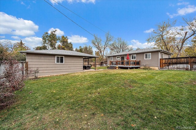 view of yard with a wooden deck