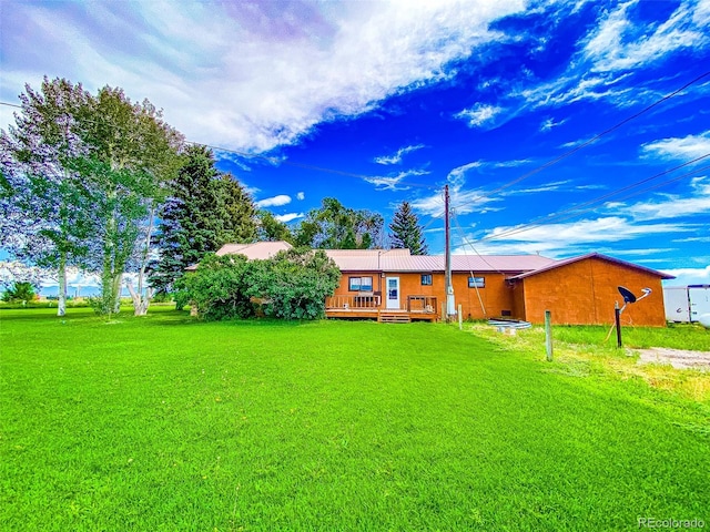 view of yard with a deck